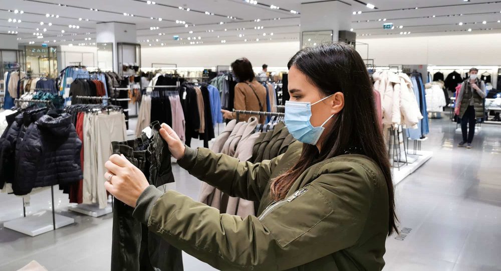 young-woman-shopping-for-clothes-retail-covid